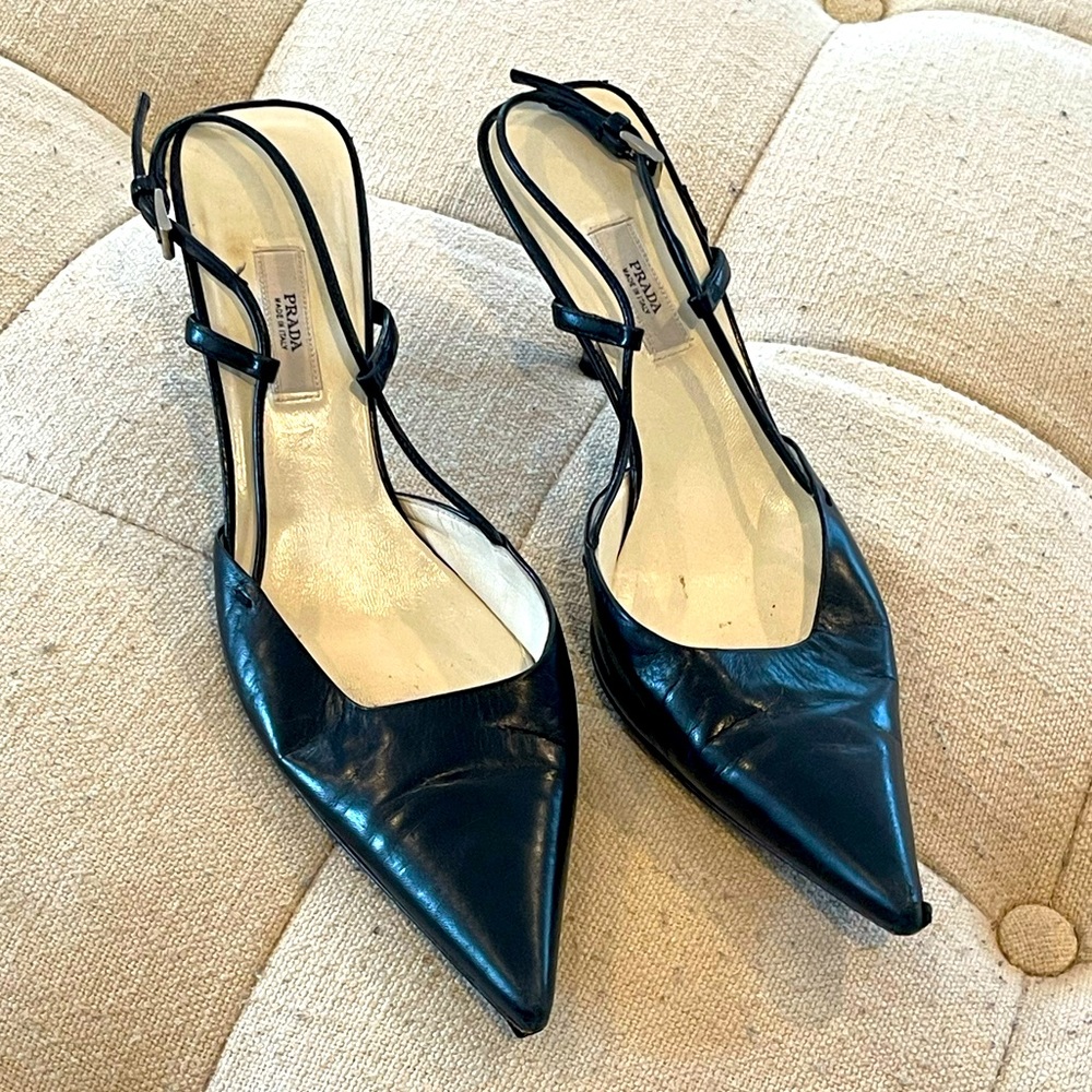Prada black leather pointy toe sling backs with silver buckle
